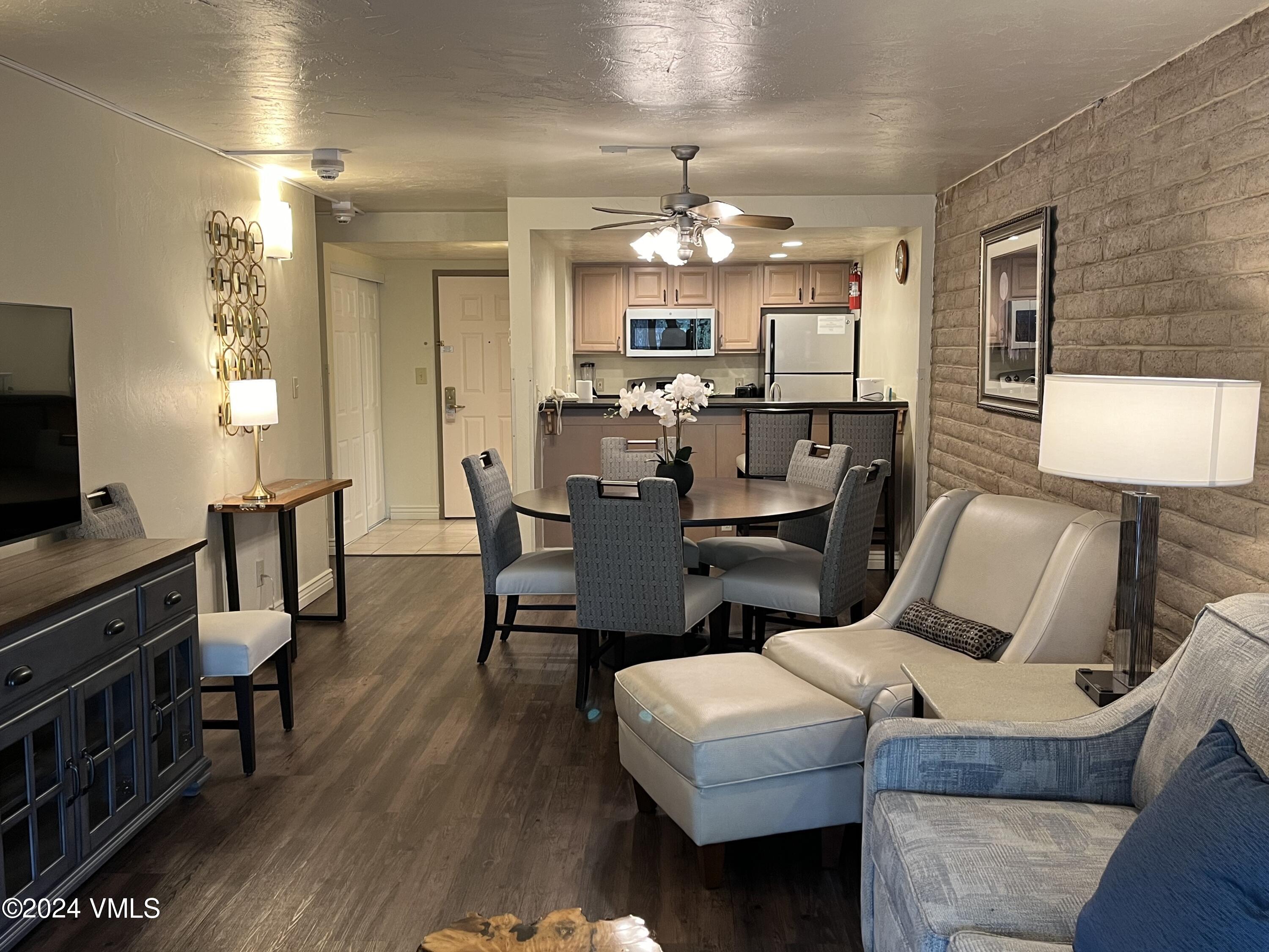 a view of a dining room with furniture and wooden floor