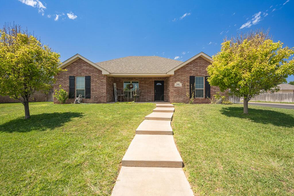 a view of a house with a yard