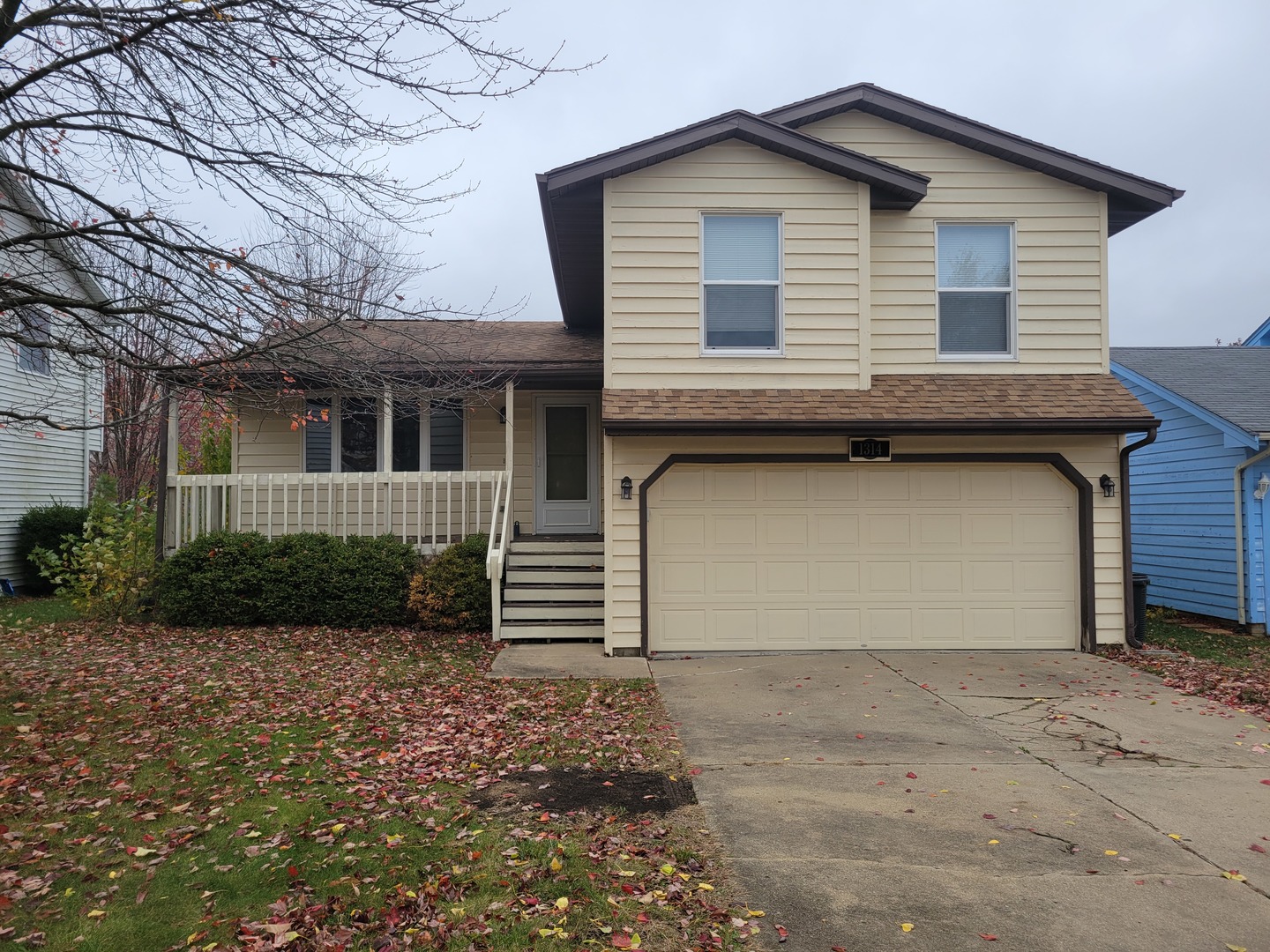 a front view of a house with garage