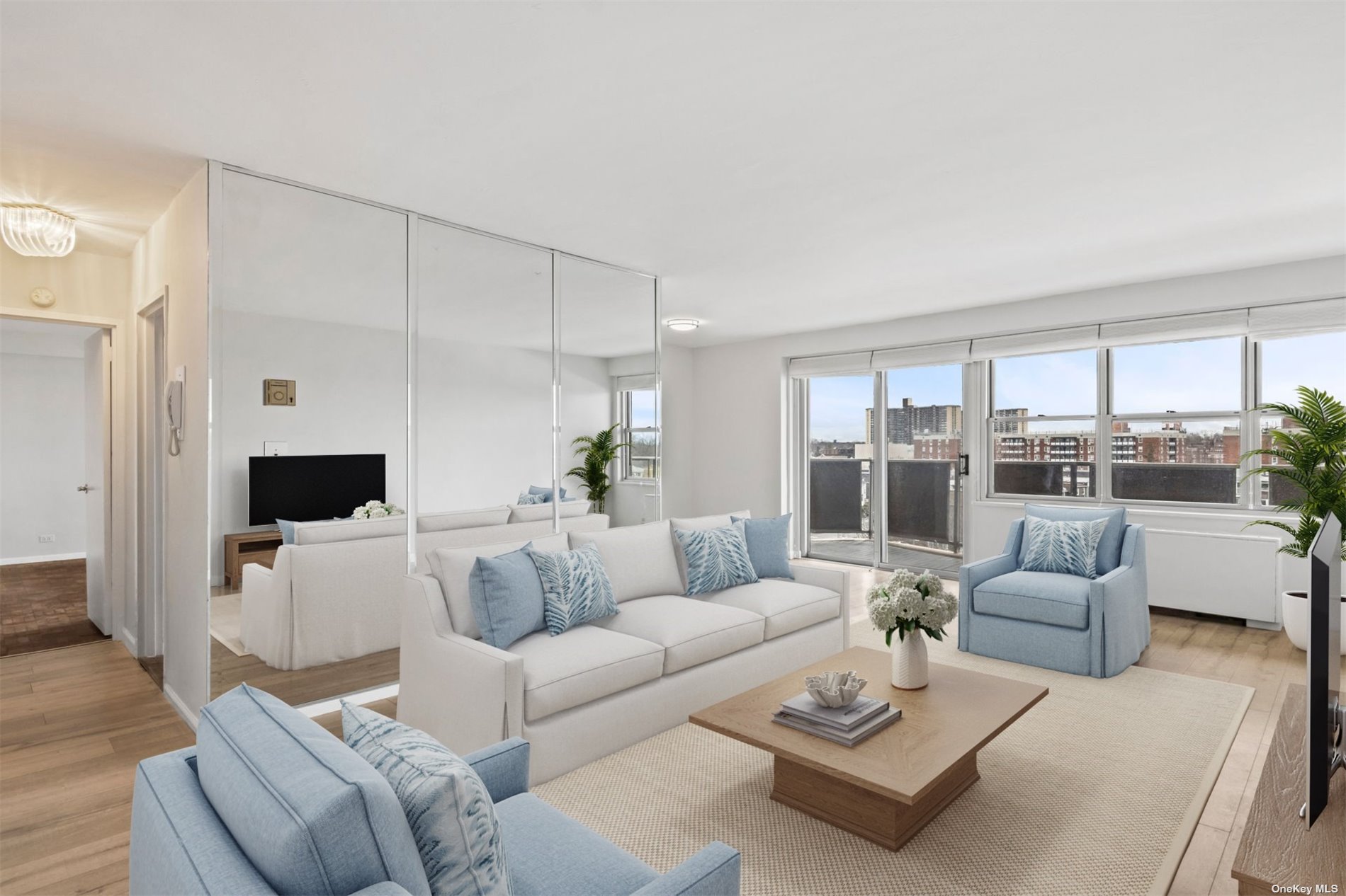 a living room with furniture and a large window