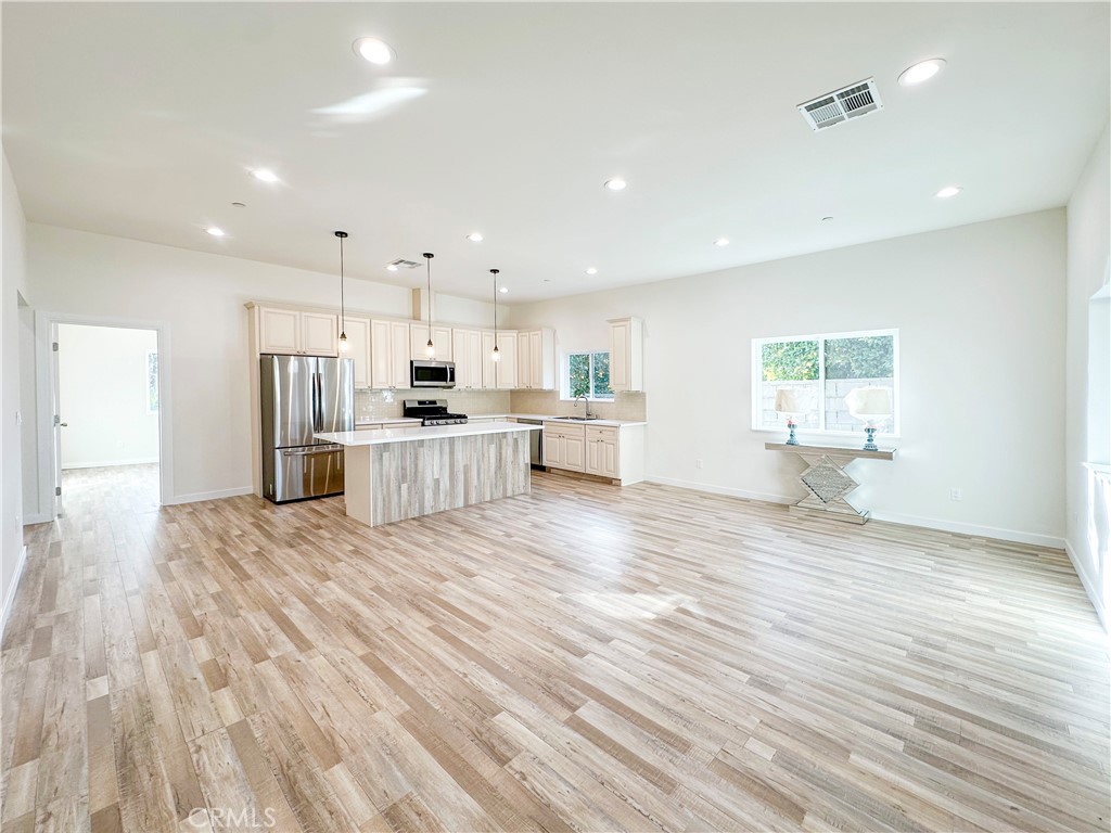 a view of kitchen and wooden floor