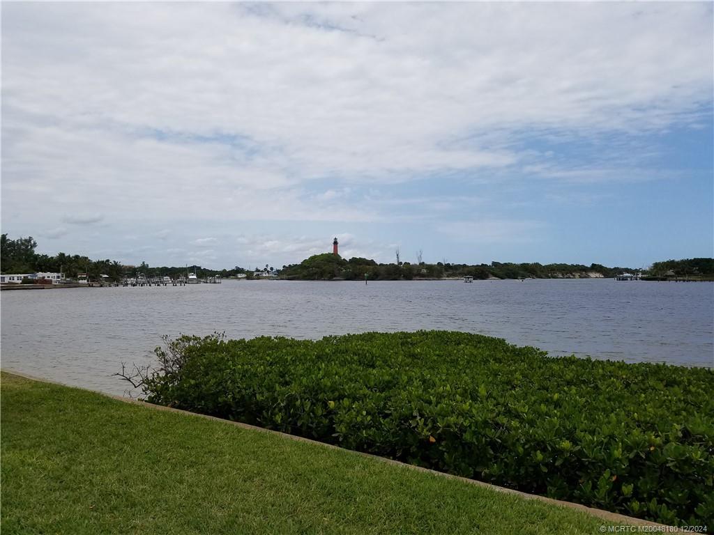 a view of a lake from a yard and lake