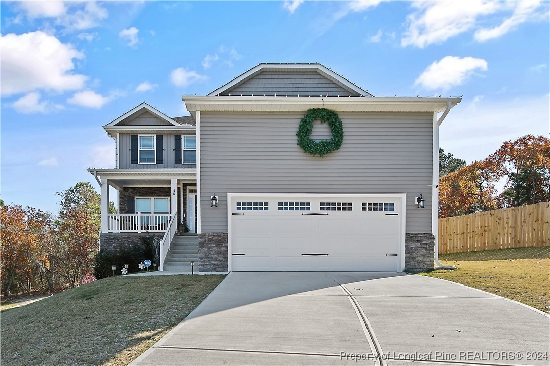 a front view of a house with a garage