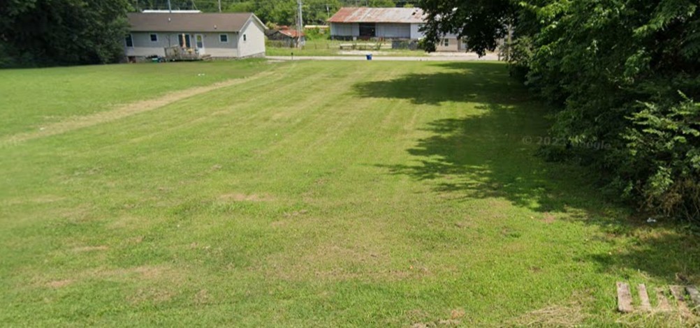 a view of a house with a big yard