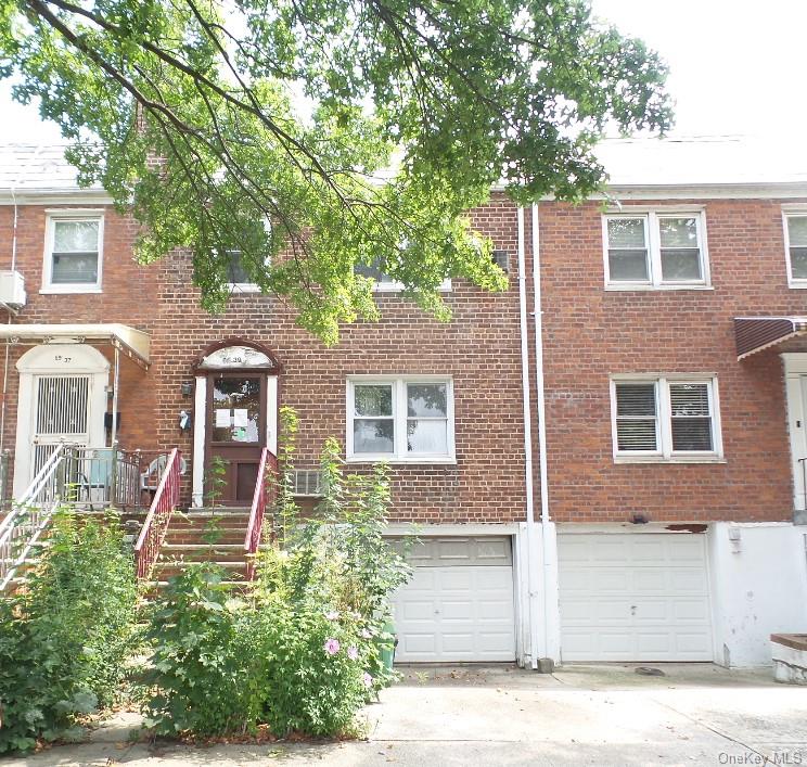 View of property with a garage