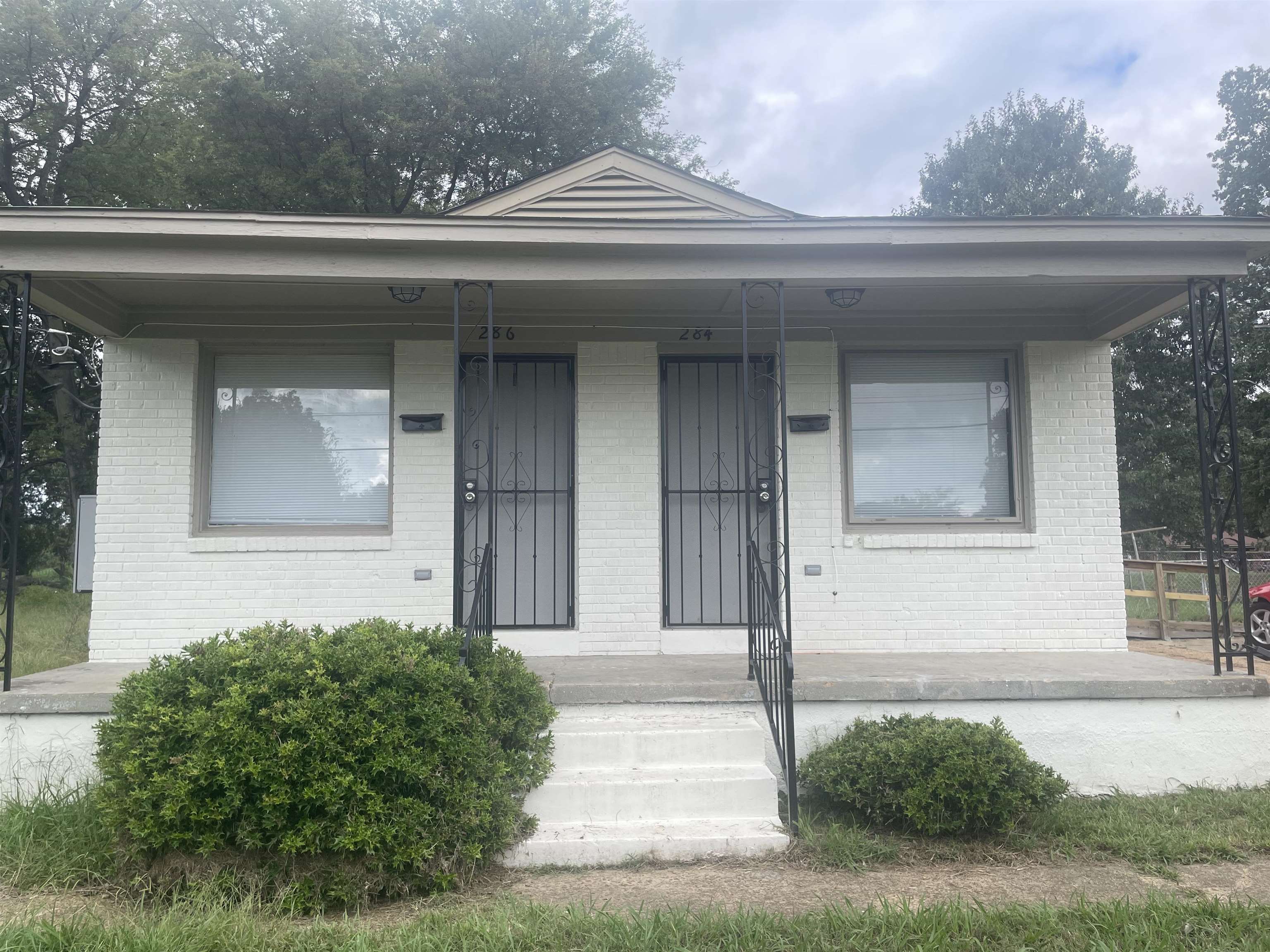 View of front of house with covered porch