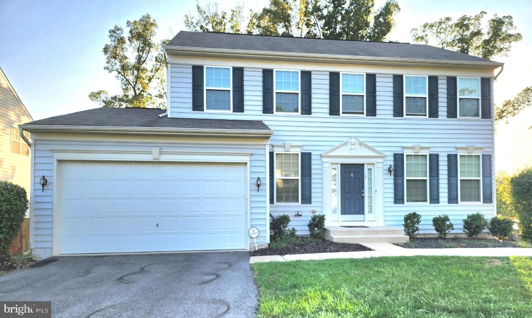 a view of a house with a yard and sitting space