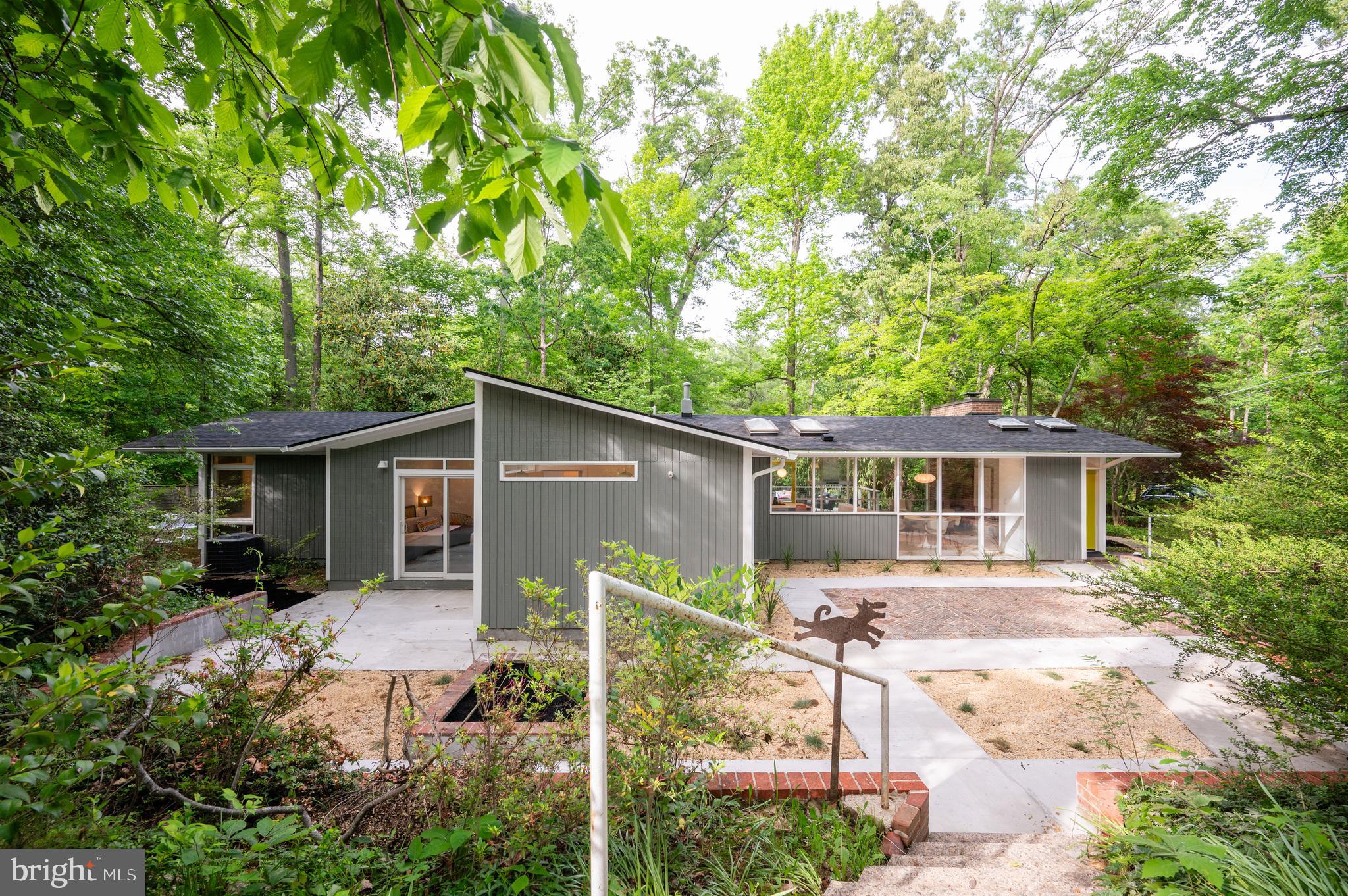 a backyard of a house with yard barbeque oven and outdoor seating