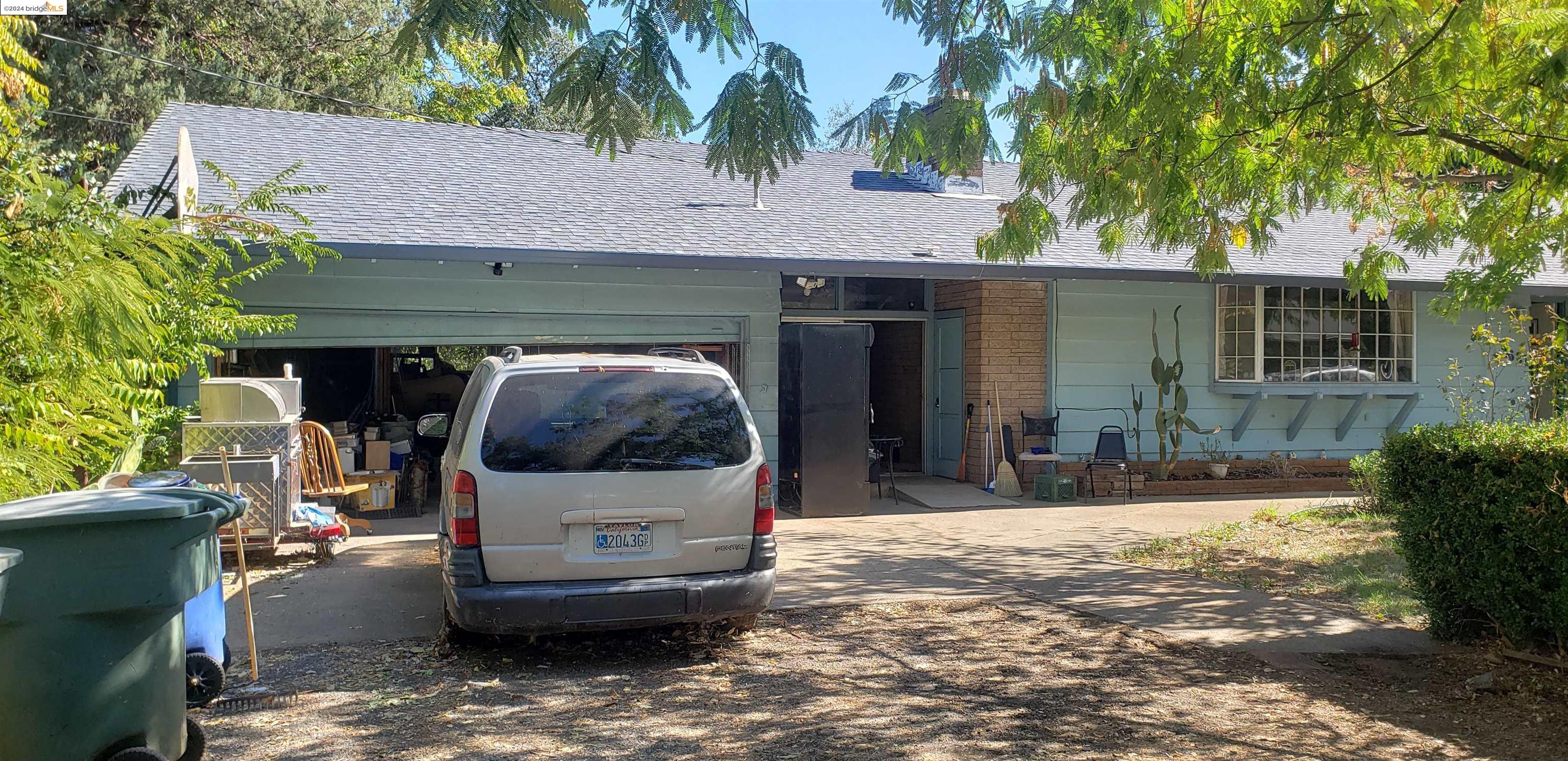 a view of house and outdoor space with swimming pool