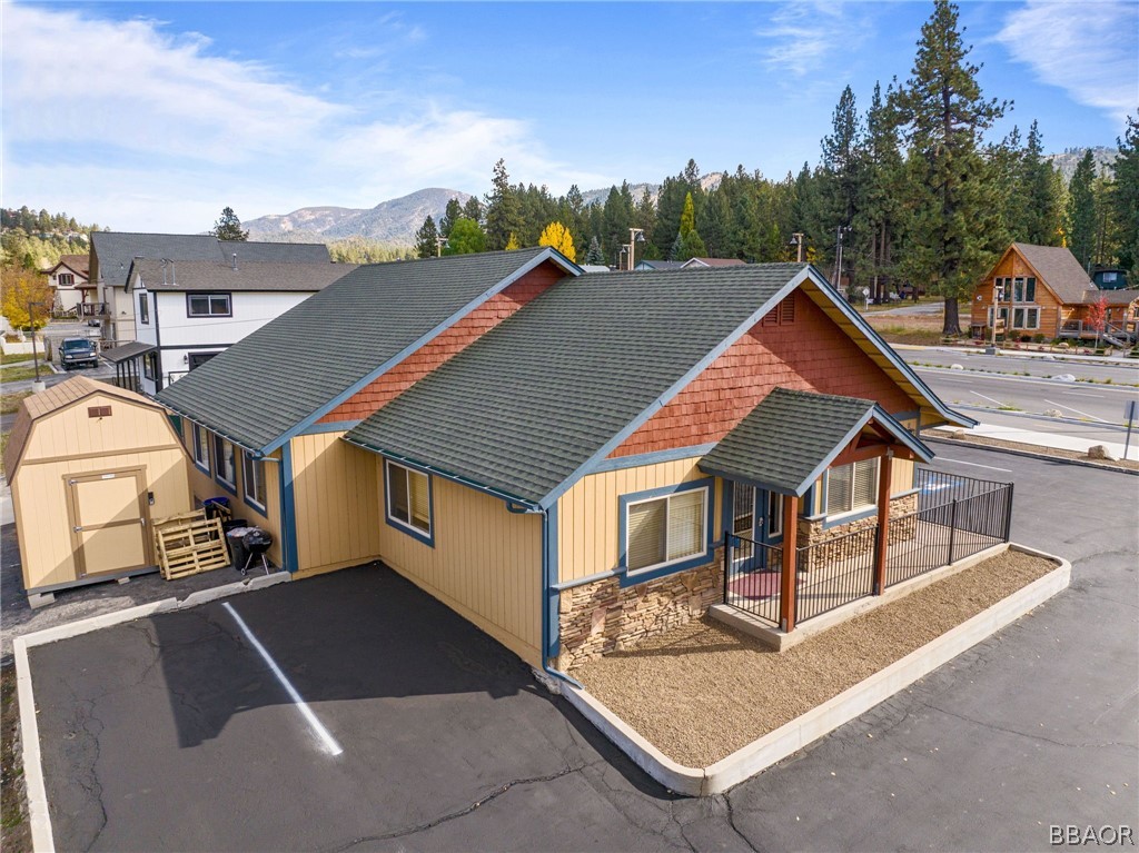 a aerial view of a house with a yard