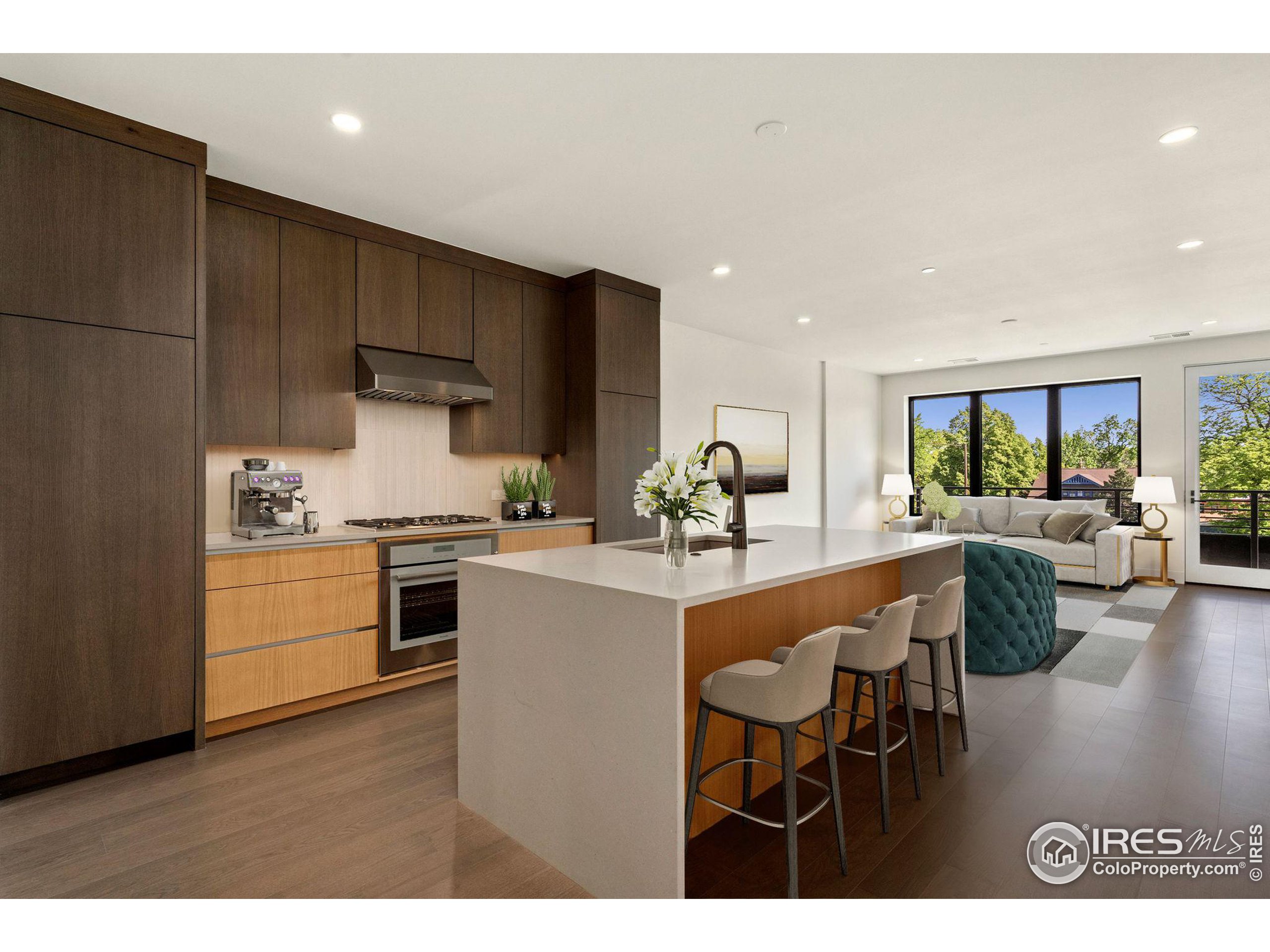 a kitchen with a table chairs refrigerator and cabinets