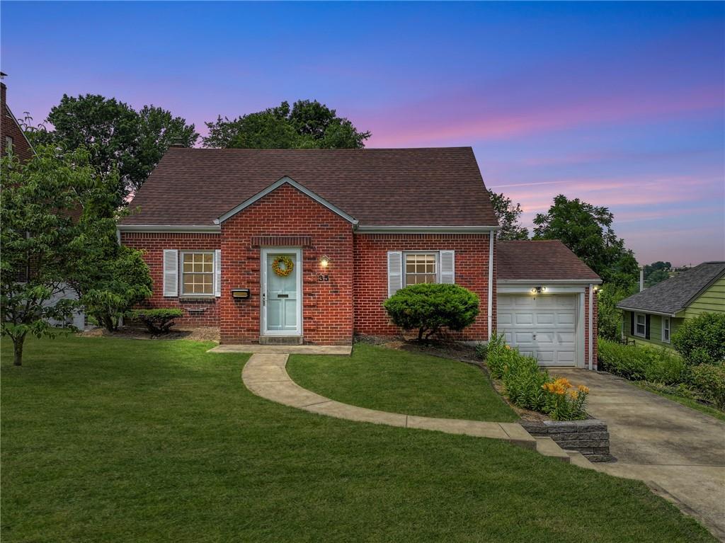 a front view of a house with a yard