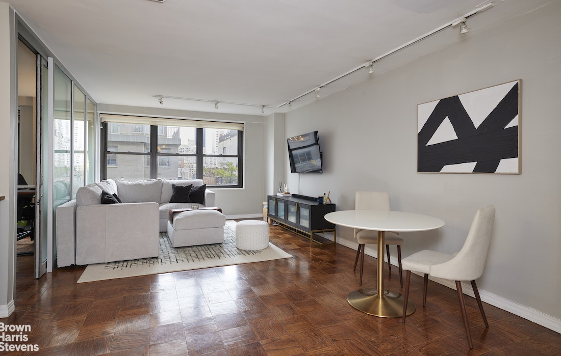 a living room with furniture and a window