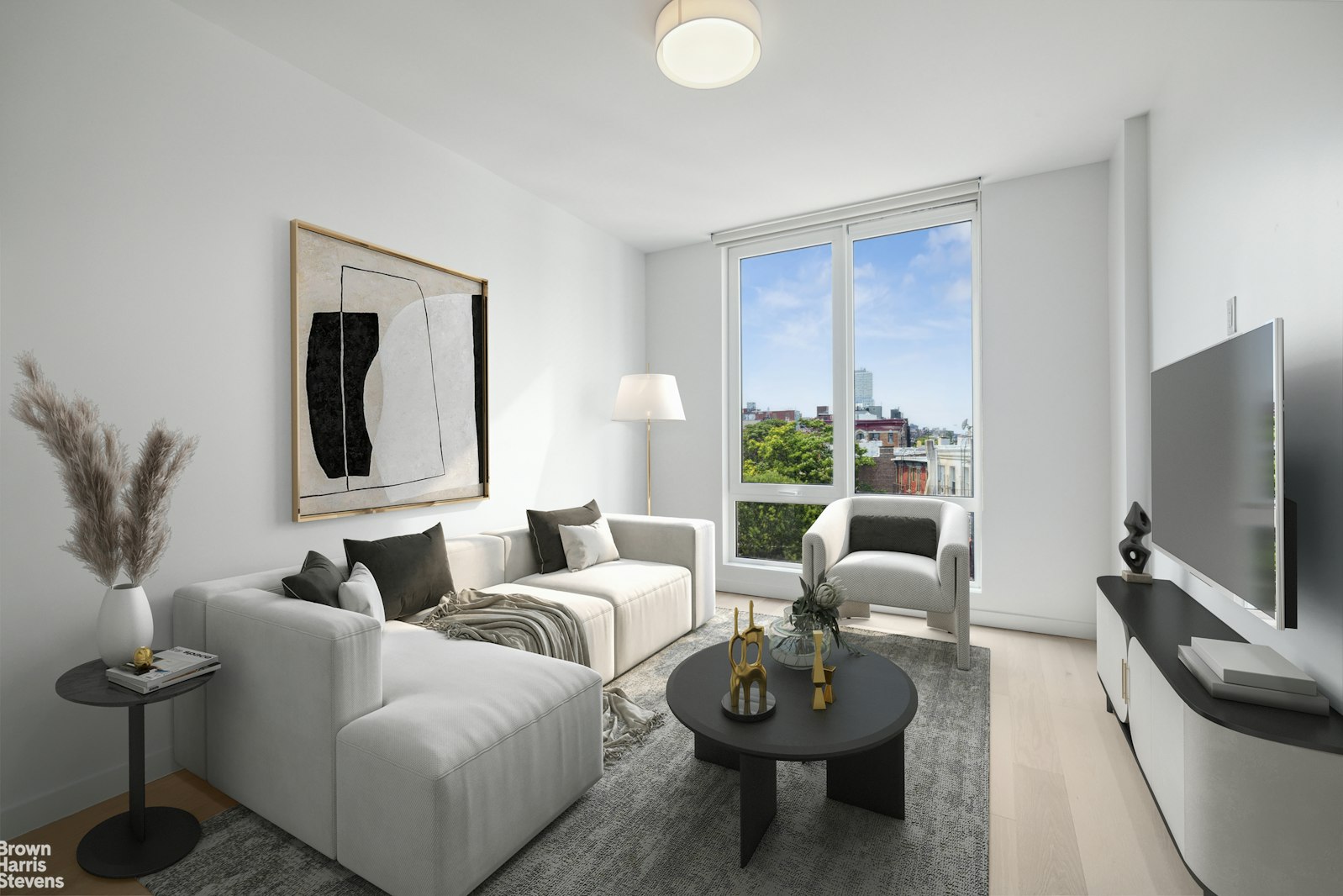 a living room with furniture and a flat screen tv