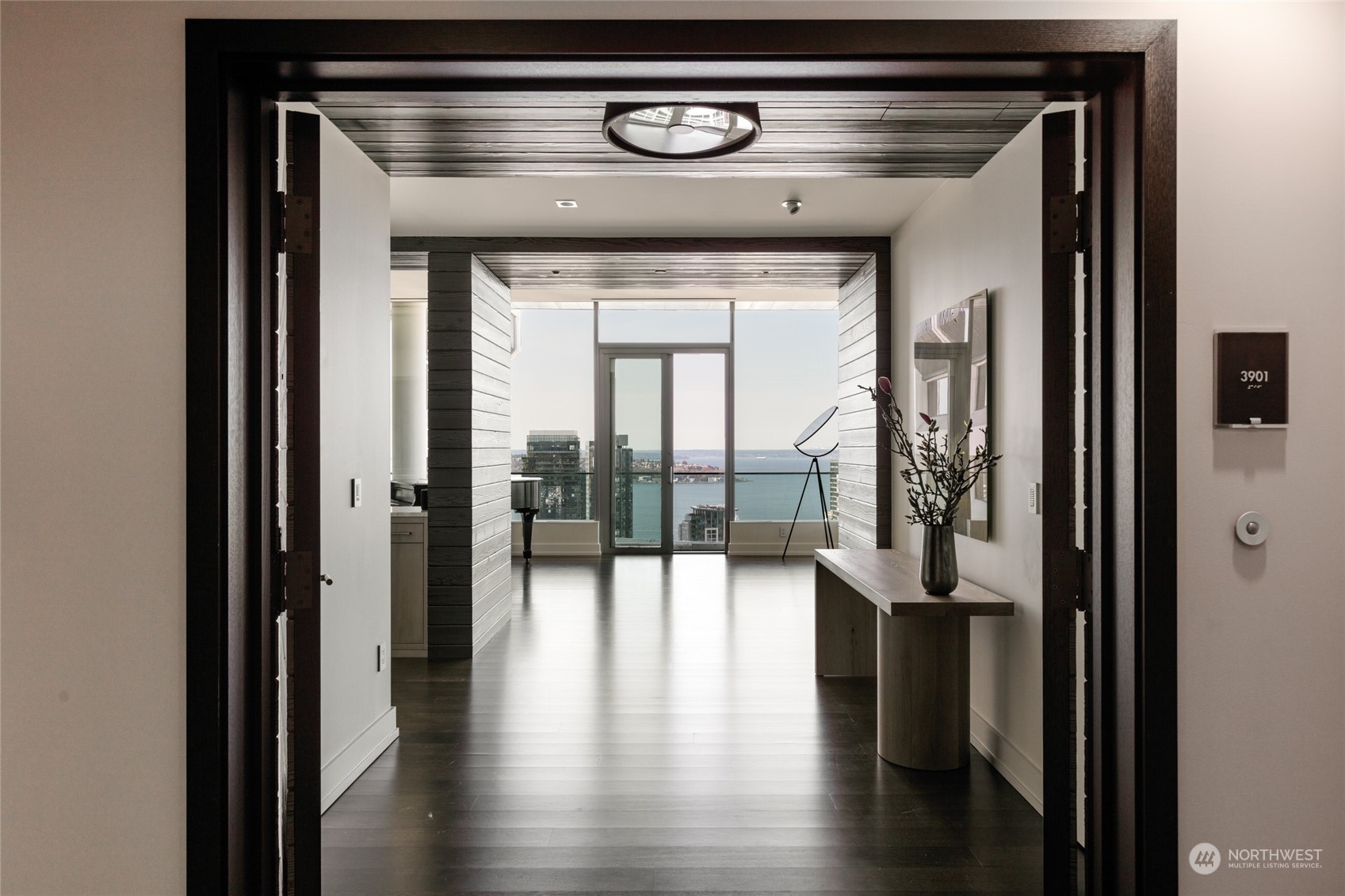 a view of an entryway door with wooden floor