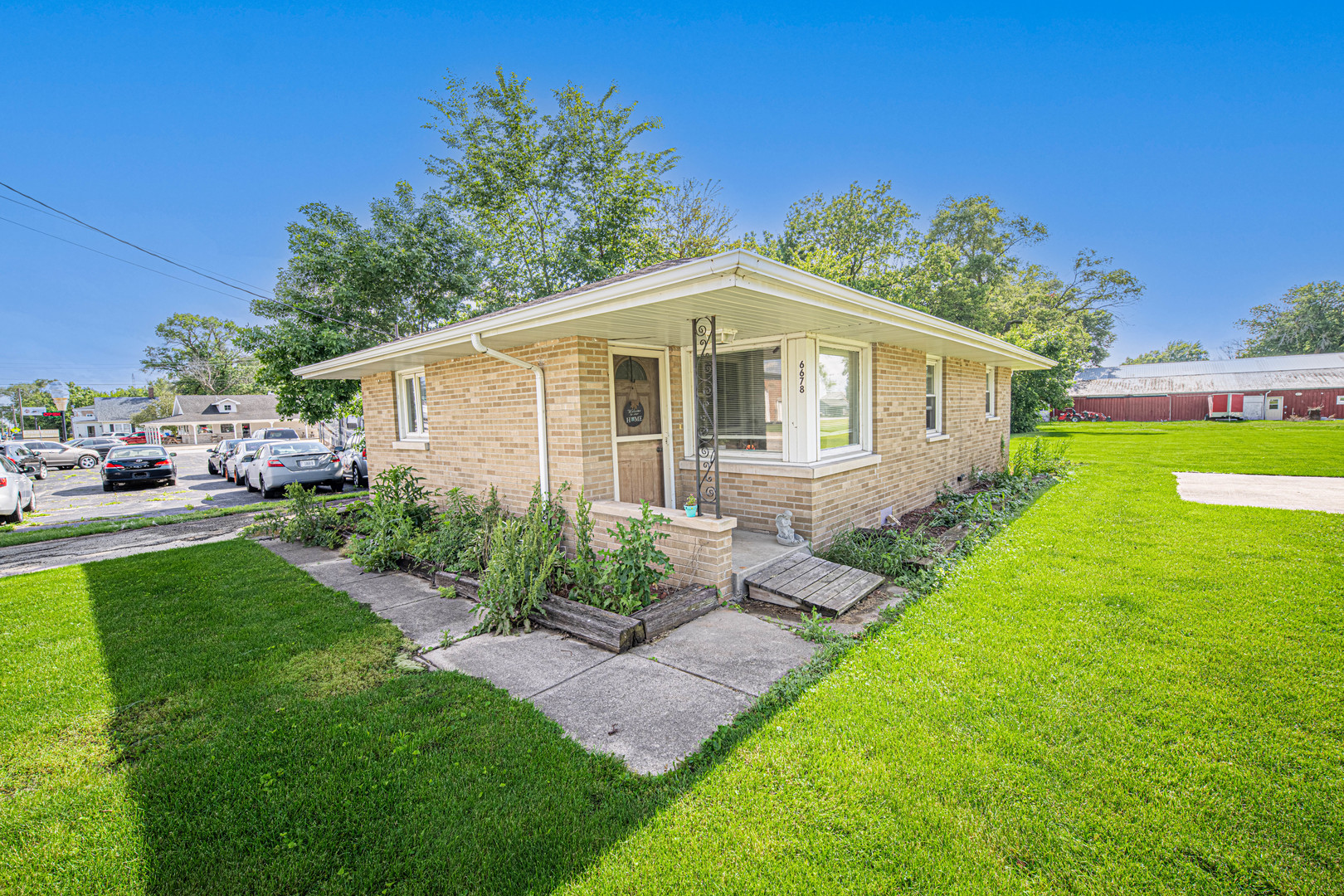 a front view of a house with garden