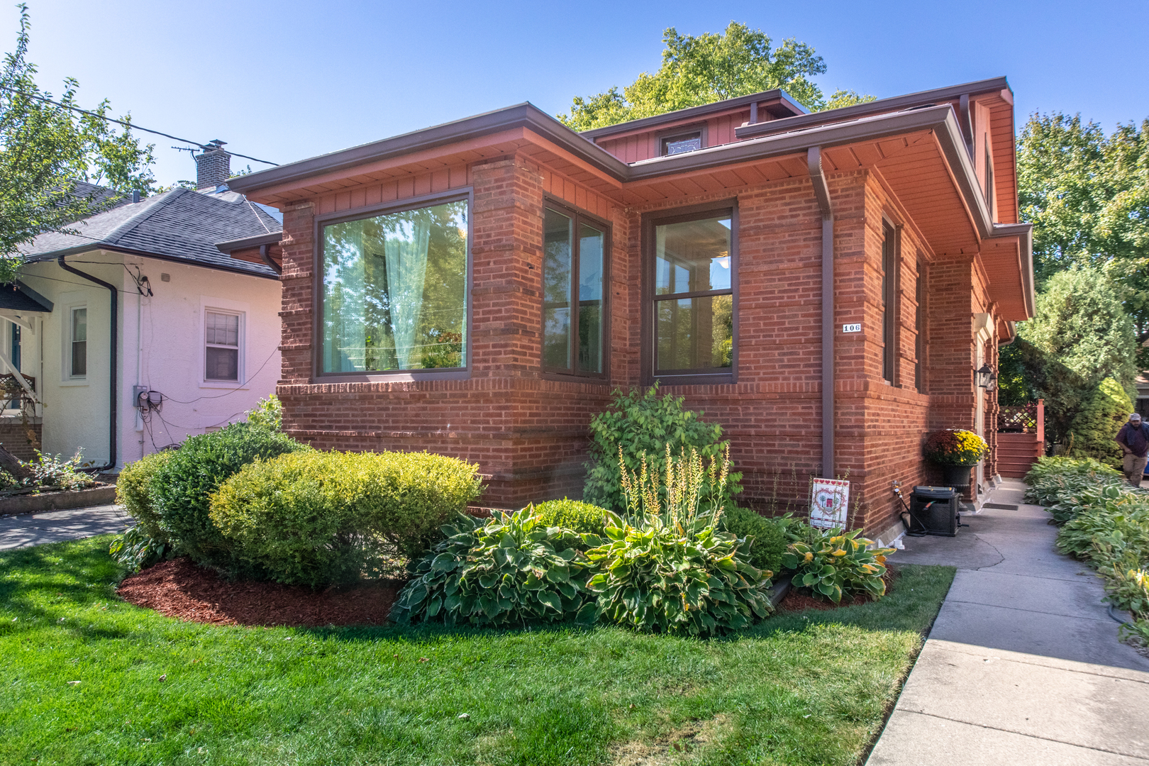 a front view of a house with garden