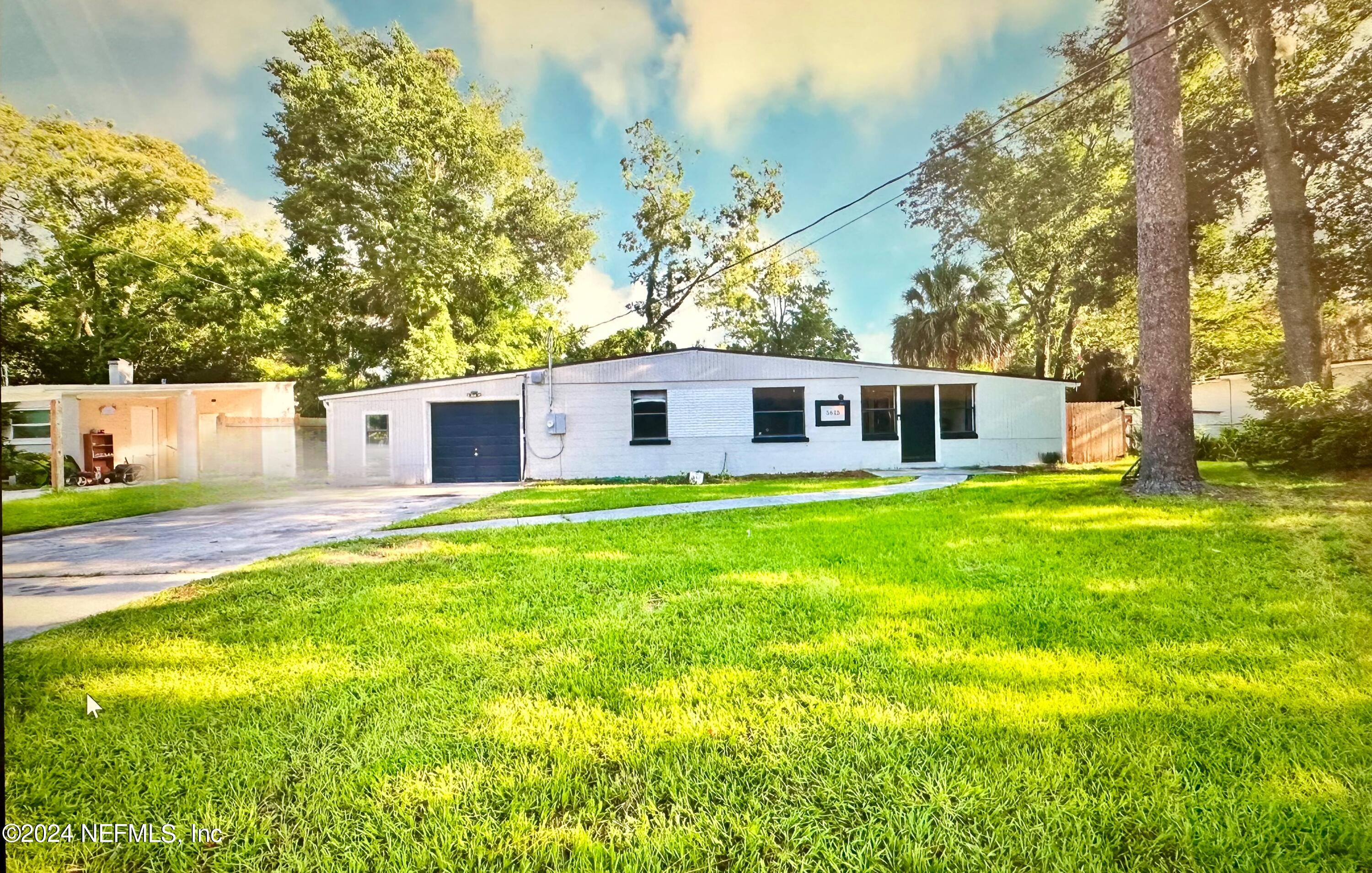 a view of a house with a big yard