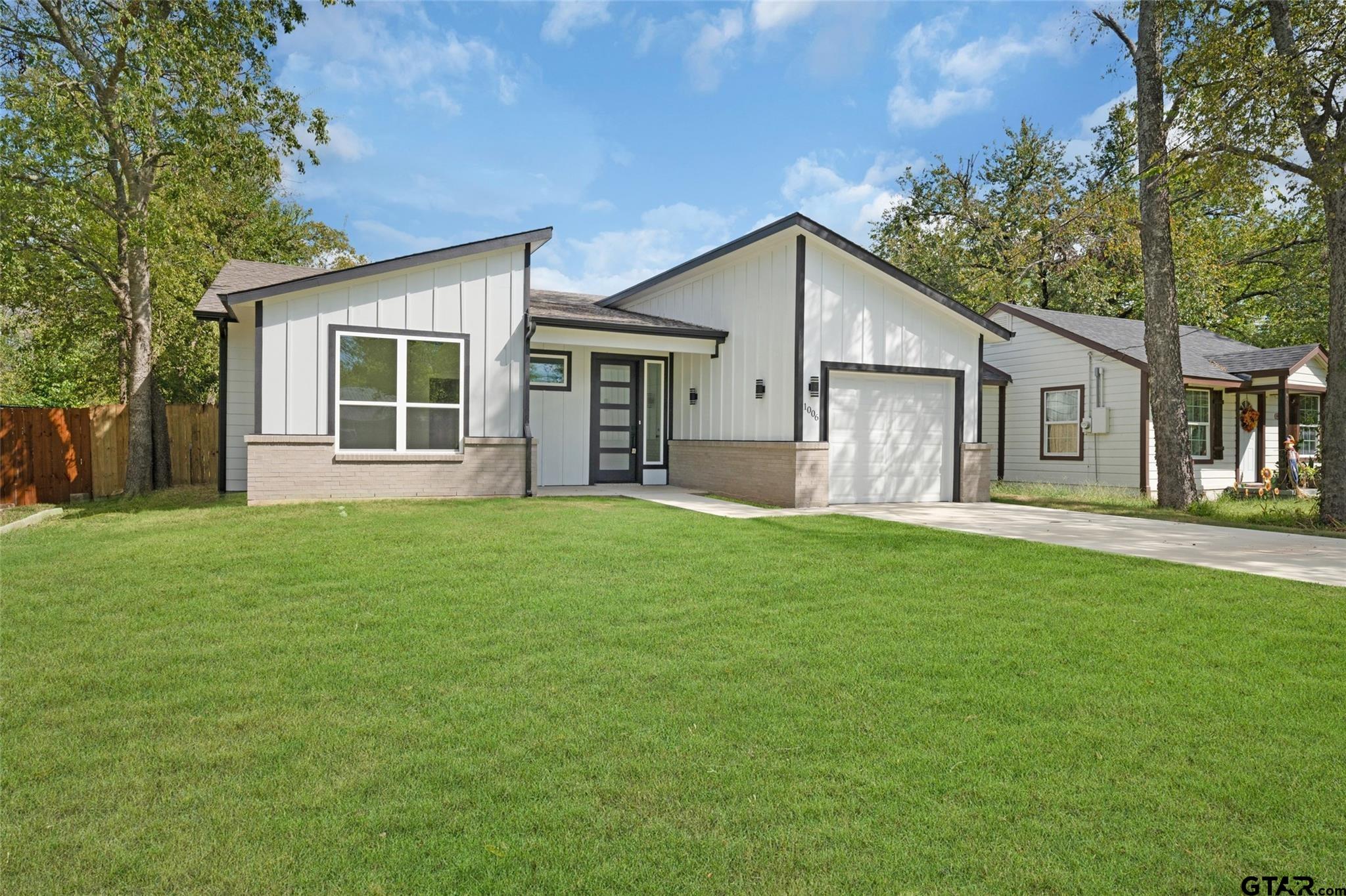 front view of a house with a yard