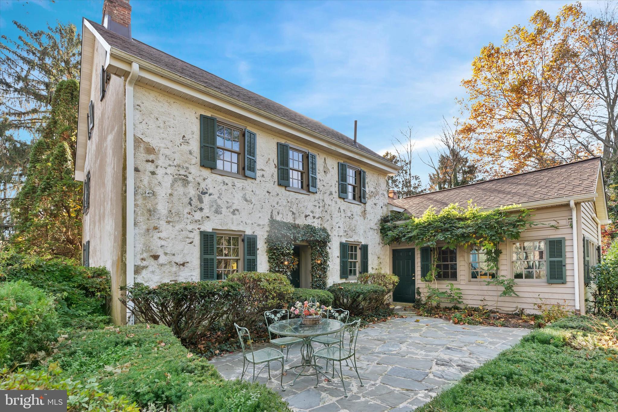 a front view of a house with a garden and porch