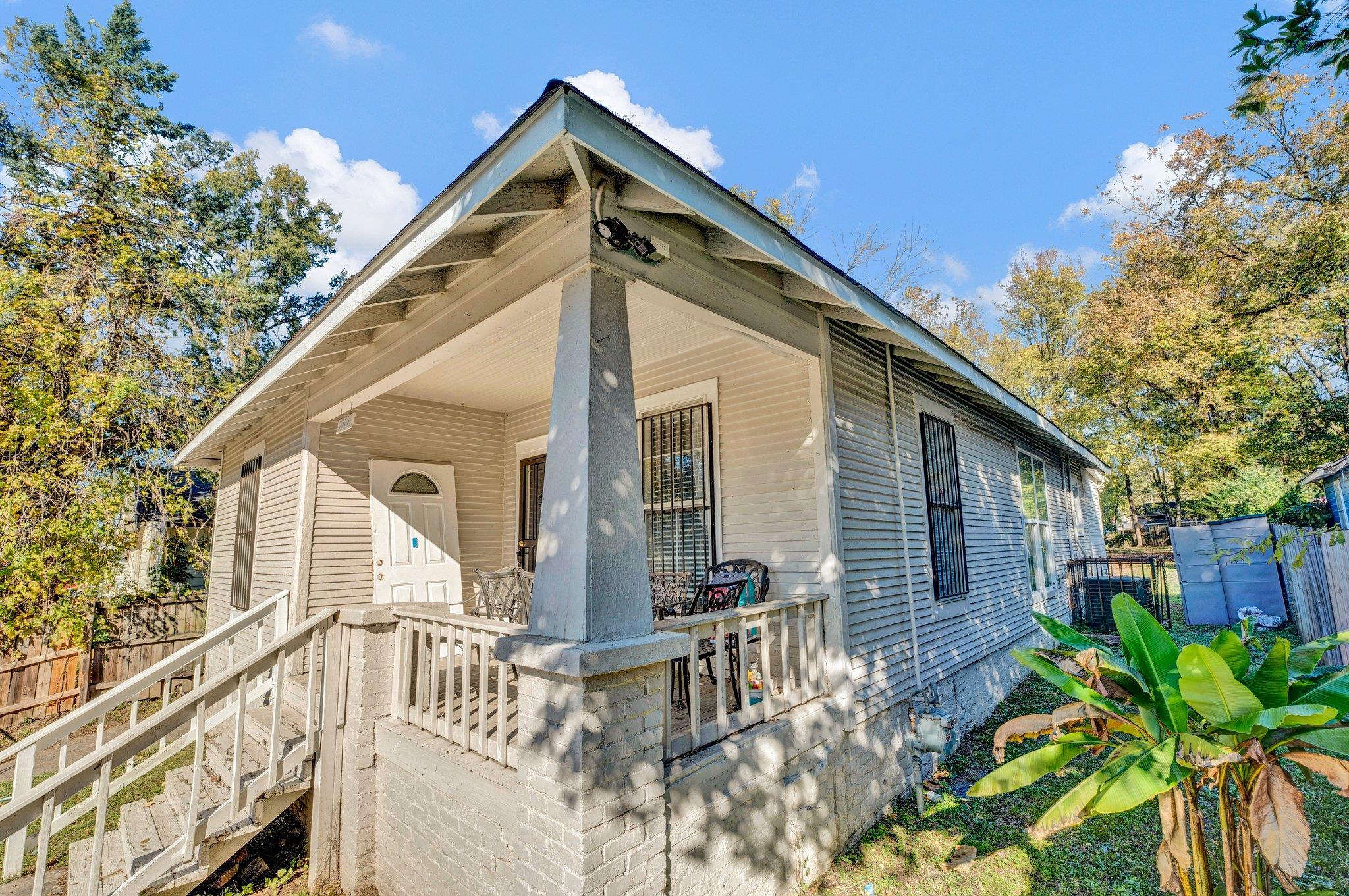 a front view of house with small garden