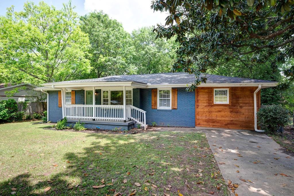 front view of a house with a yard