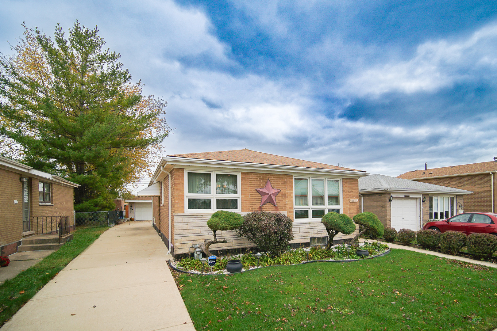 a front view of house with yard and green space