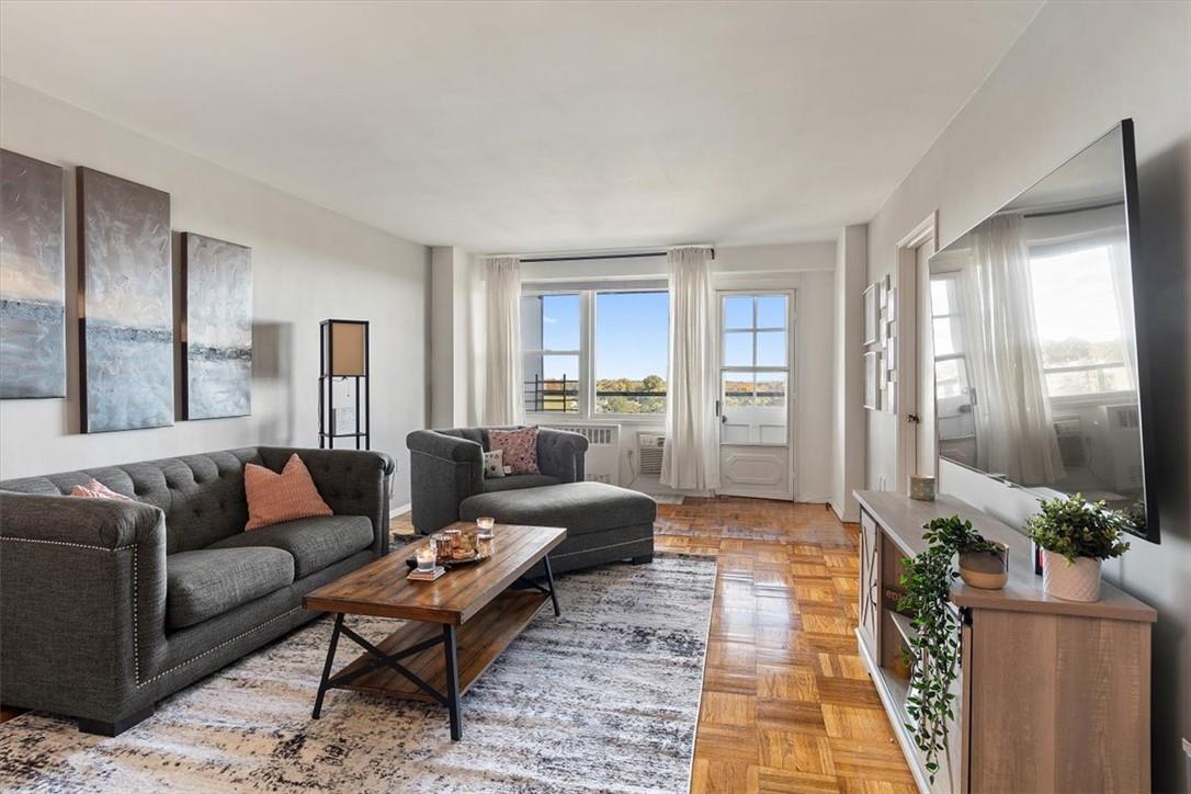 Living room featuring light parquet floors