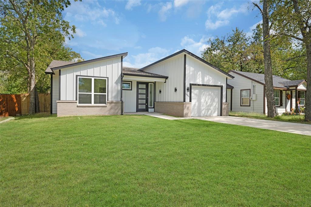 front view of a house with a yard