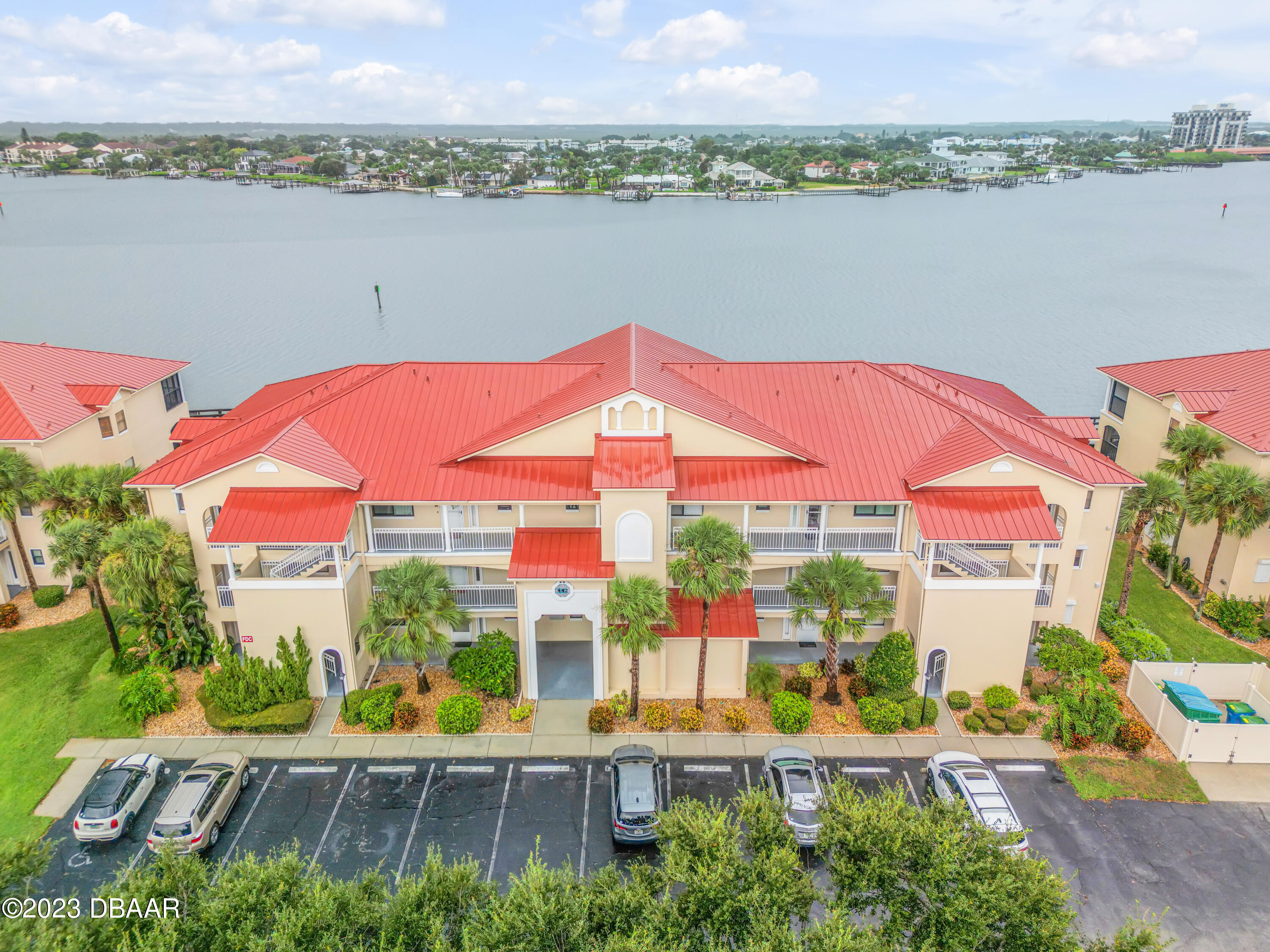 an aerial view of a house with a lake view