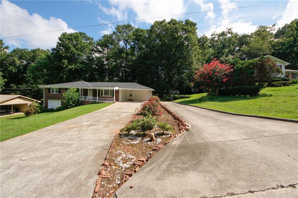 a view of house with outdoor space and street view