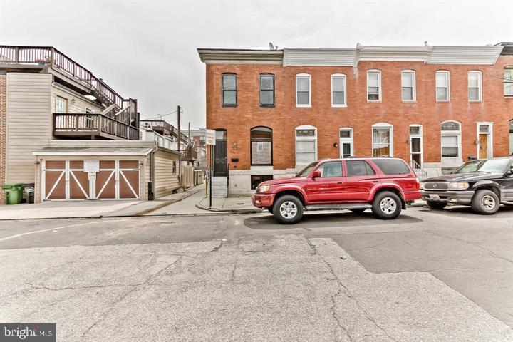 a view of a car parked in front of a building