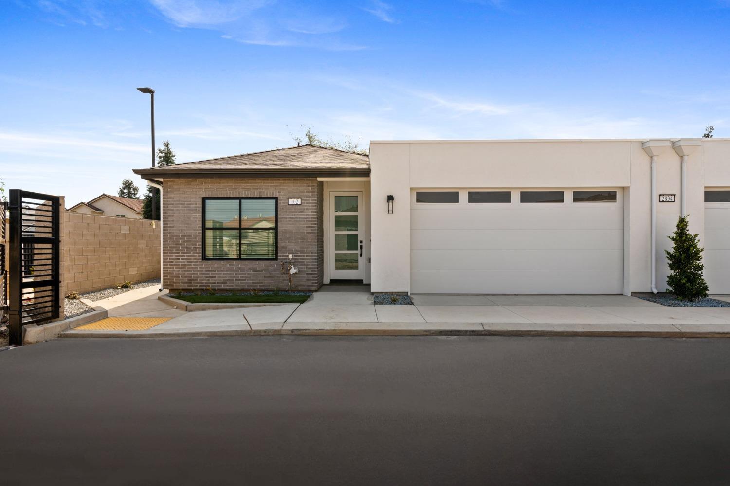 a front door view of a house with a garage