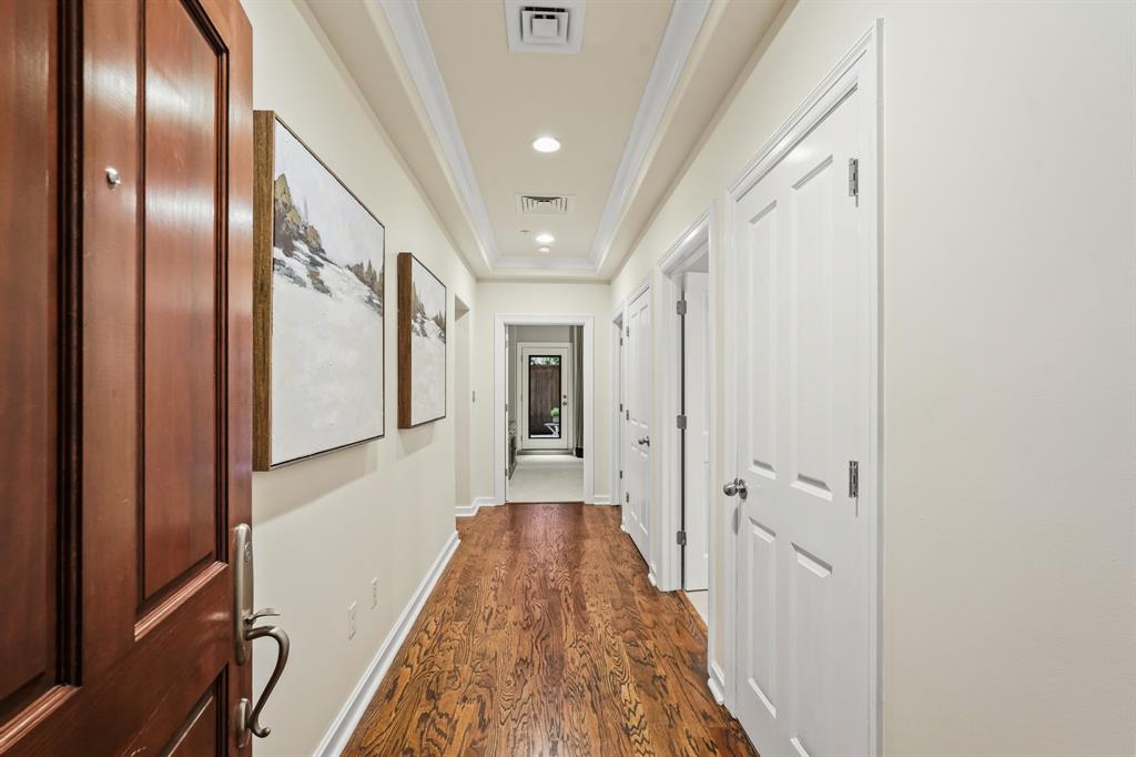 Welcoming foyer with recently refinished wood flooring.