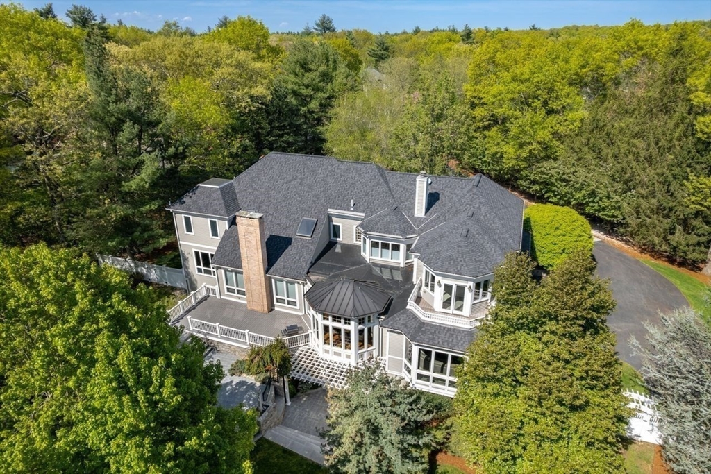 an aerial view of a house with a garden