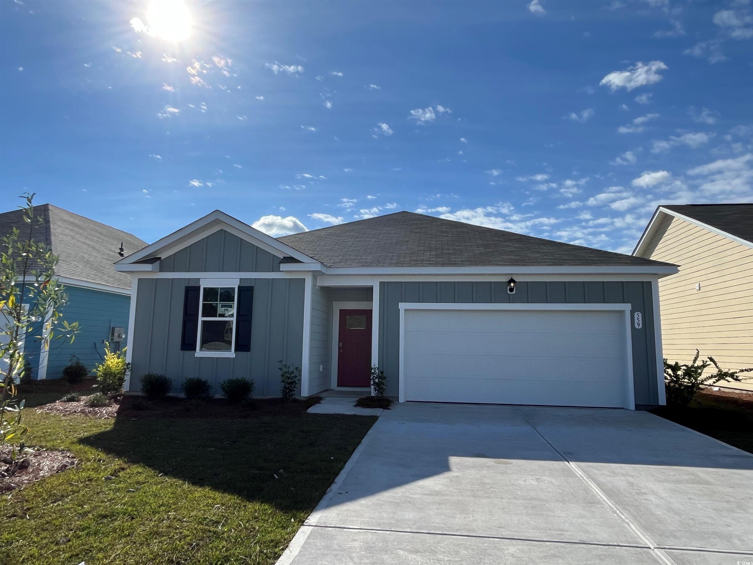 Ranch-style house featuring a garage