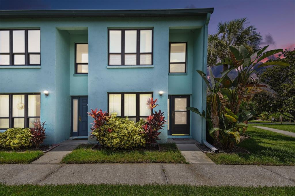 a front view of a house having garden