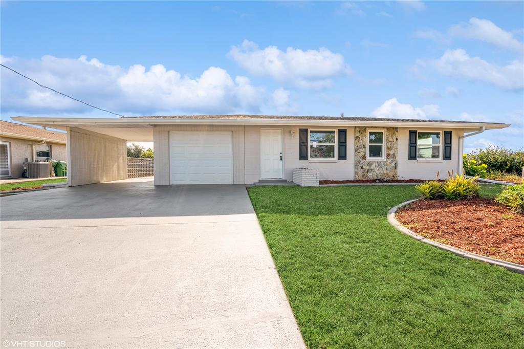 a view of a house with a backyard