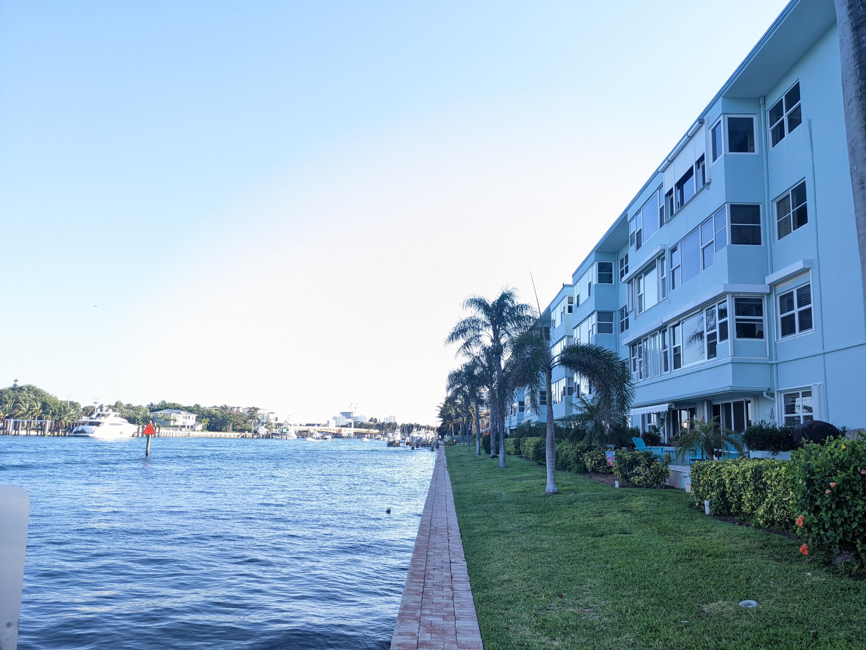 a view of a building and trees in the background