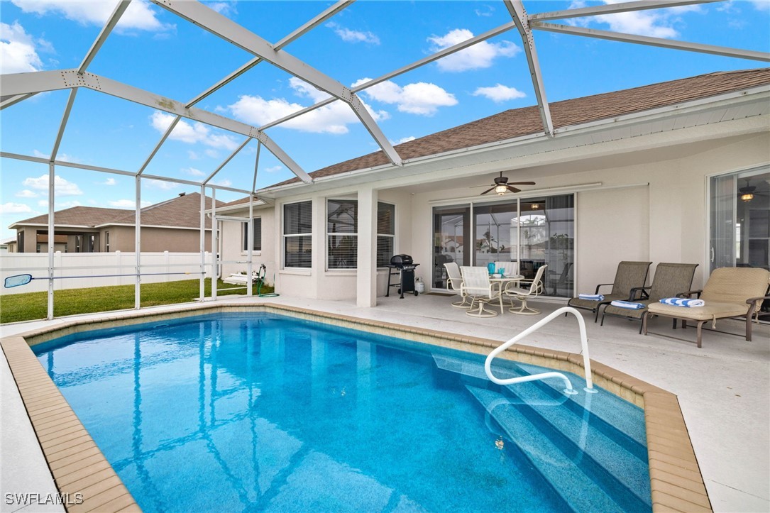 a view of a swimming pool with chairs