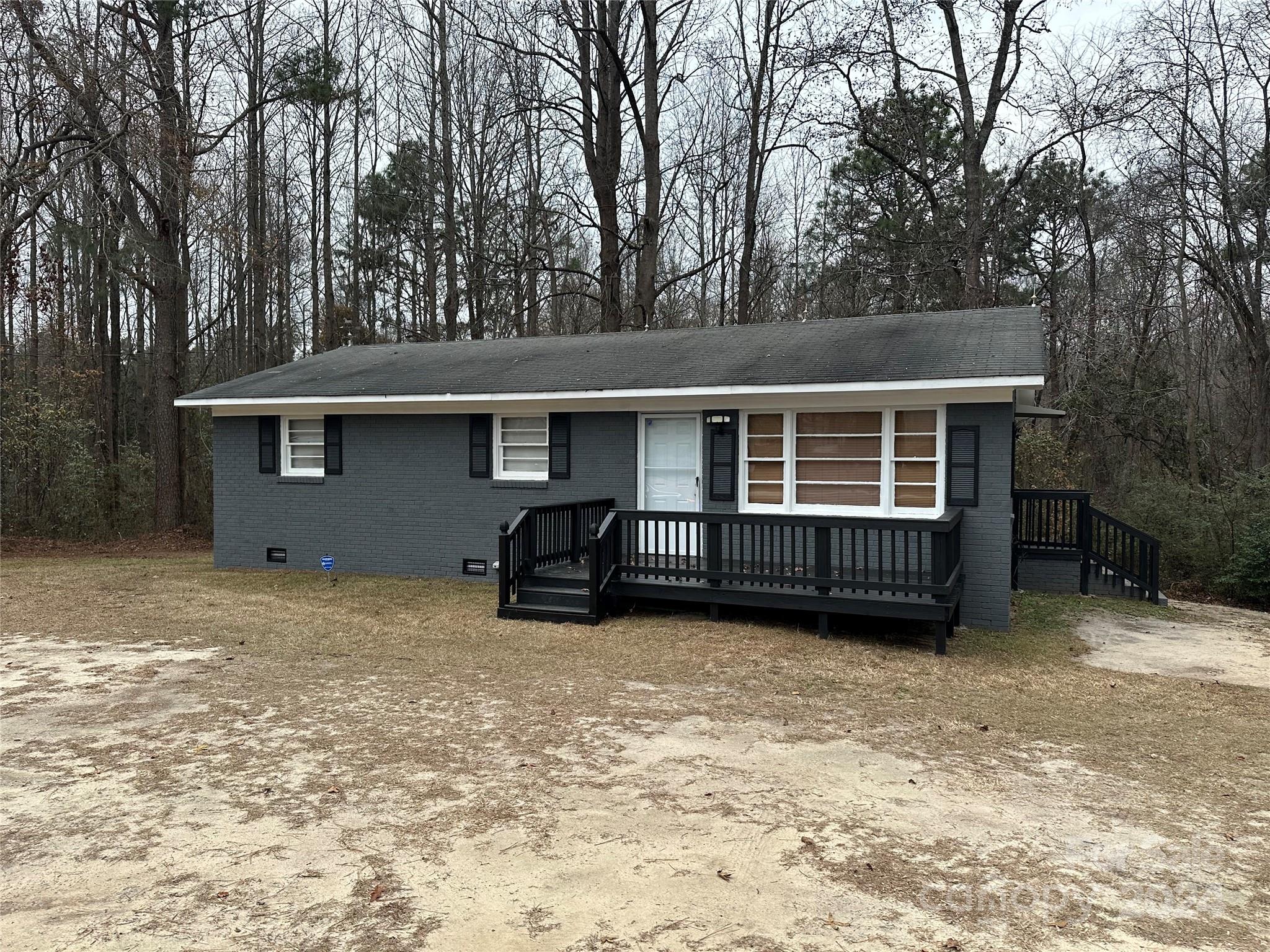 a view of a house with a yard and garage