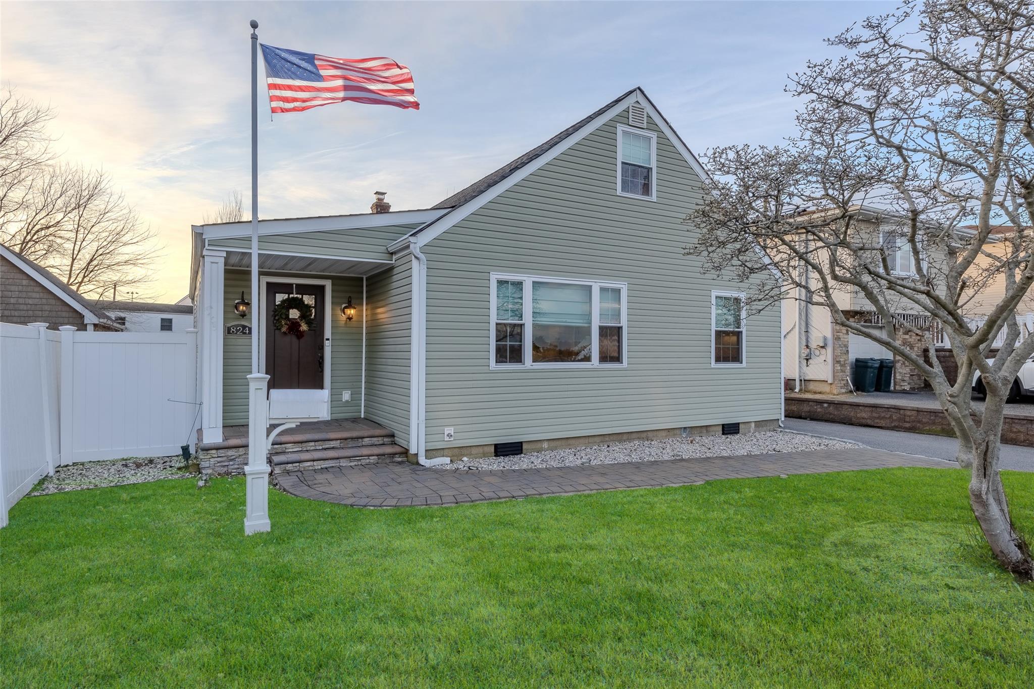 View of front of home with a yard