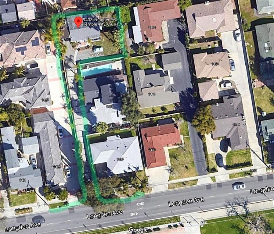 an aerial view of residential house with outdoor space