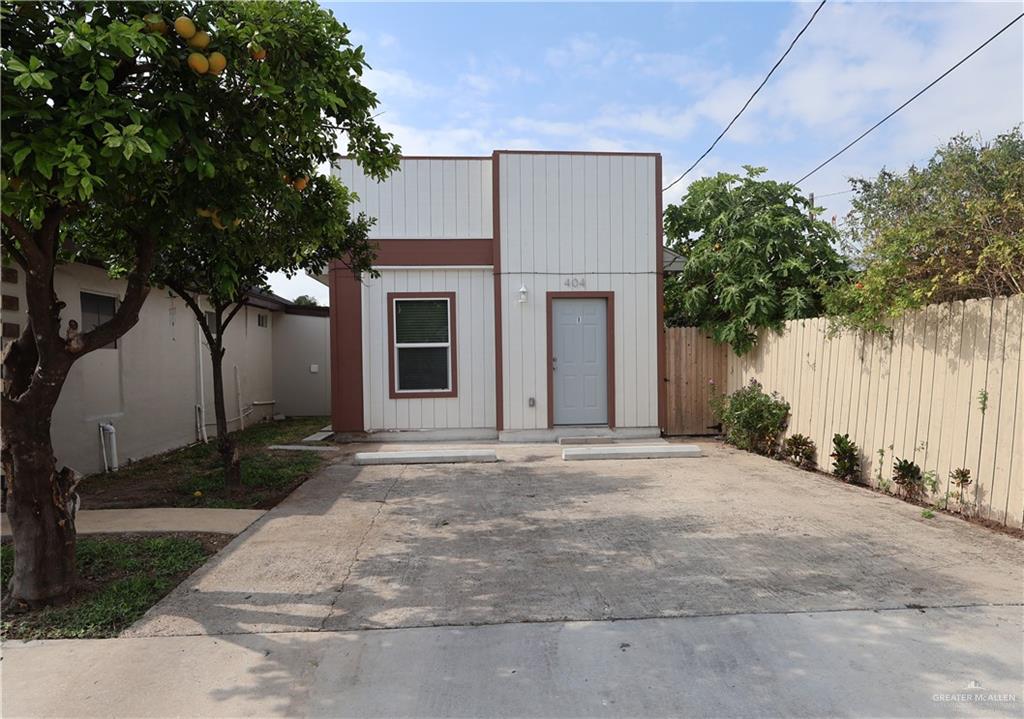 a view of a house with a yard and garage