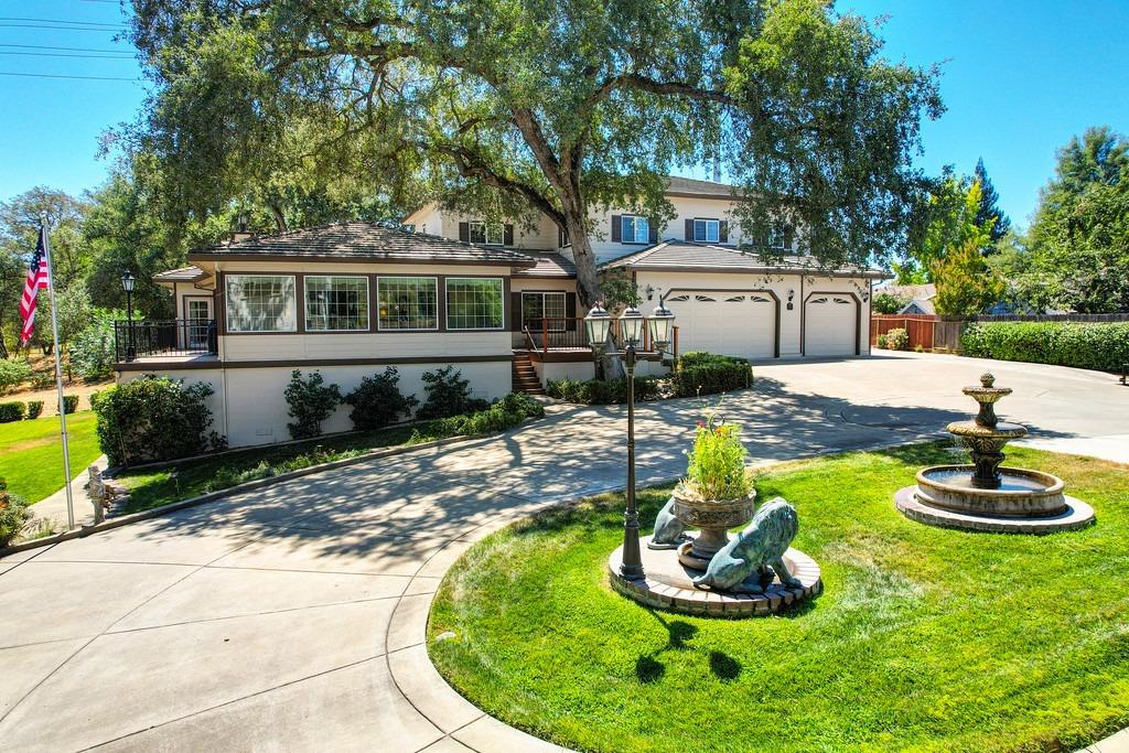 a front view of a house with a yard porch and sitting area