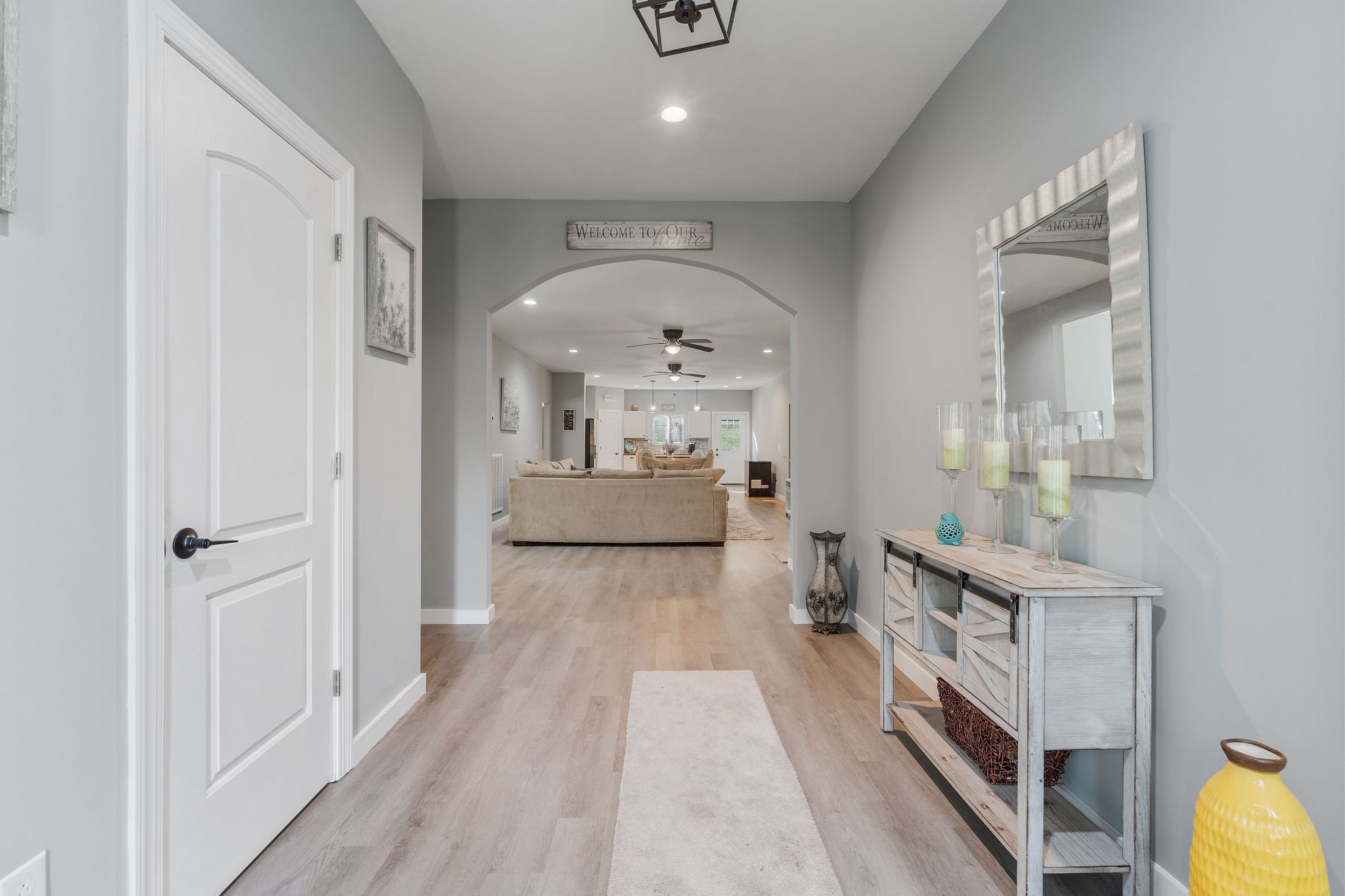 a view of a hallway view with wooden floor and staircase