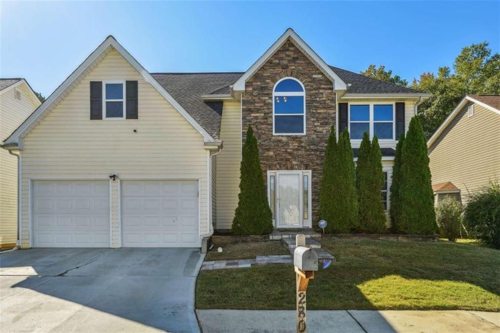 front view of a house with a yard