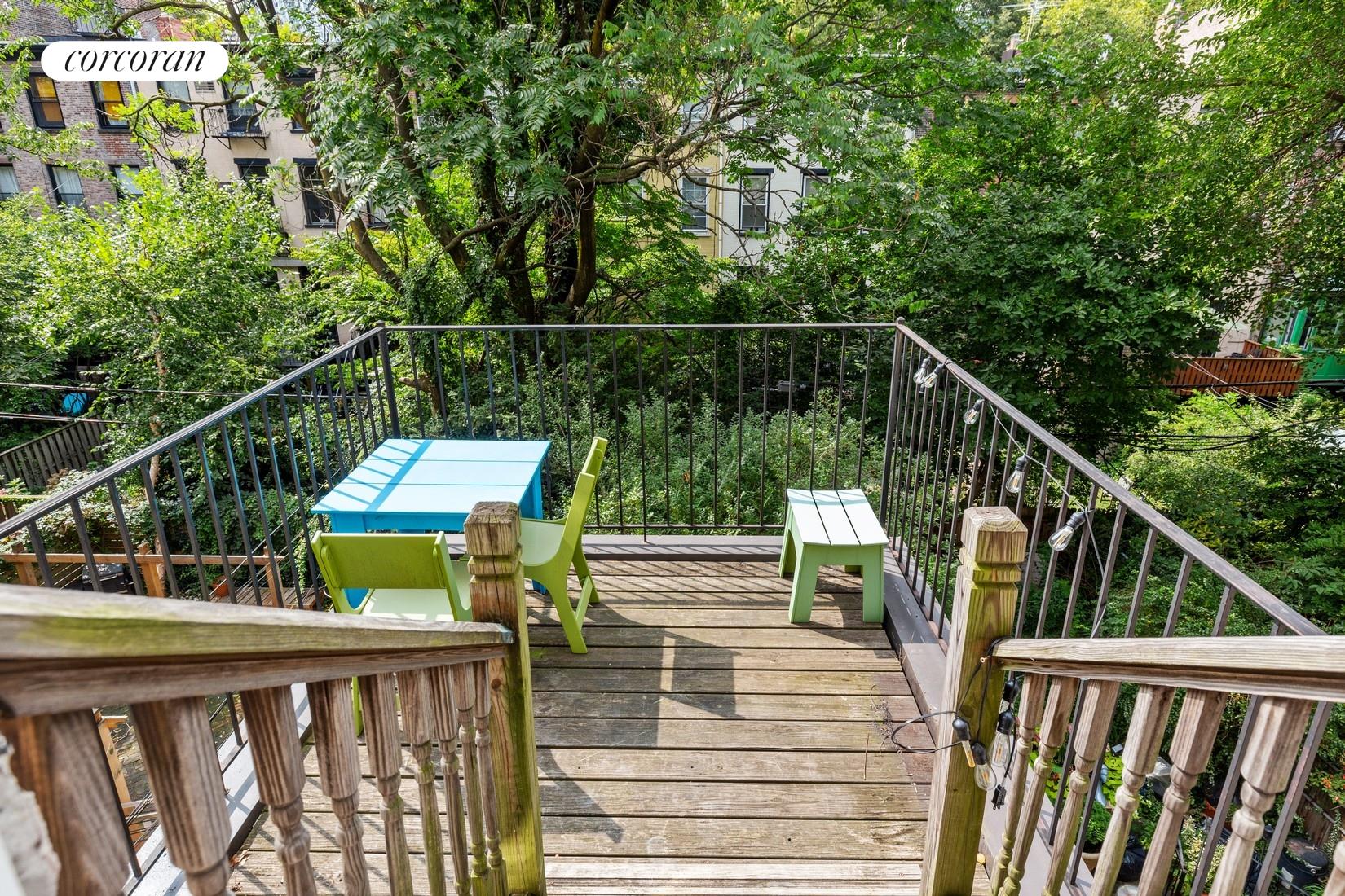 a view of balcony with deck and wooden floor