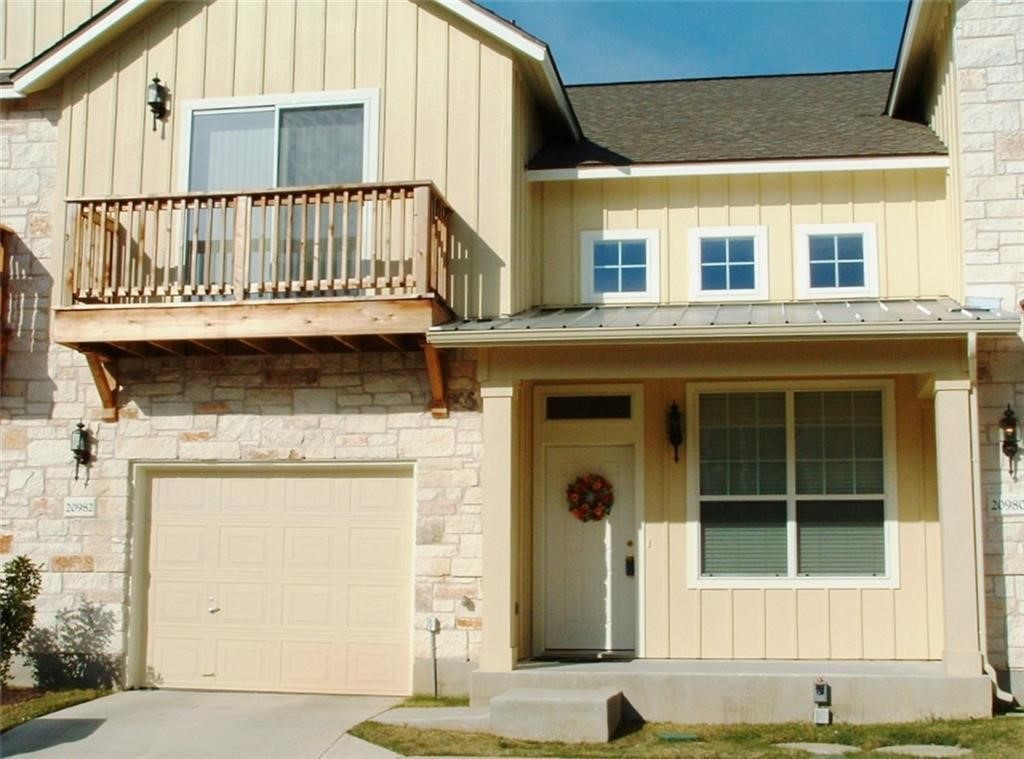 front view of a house with a small yard