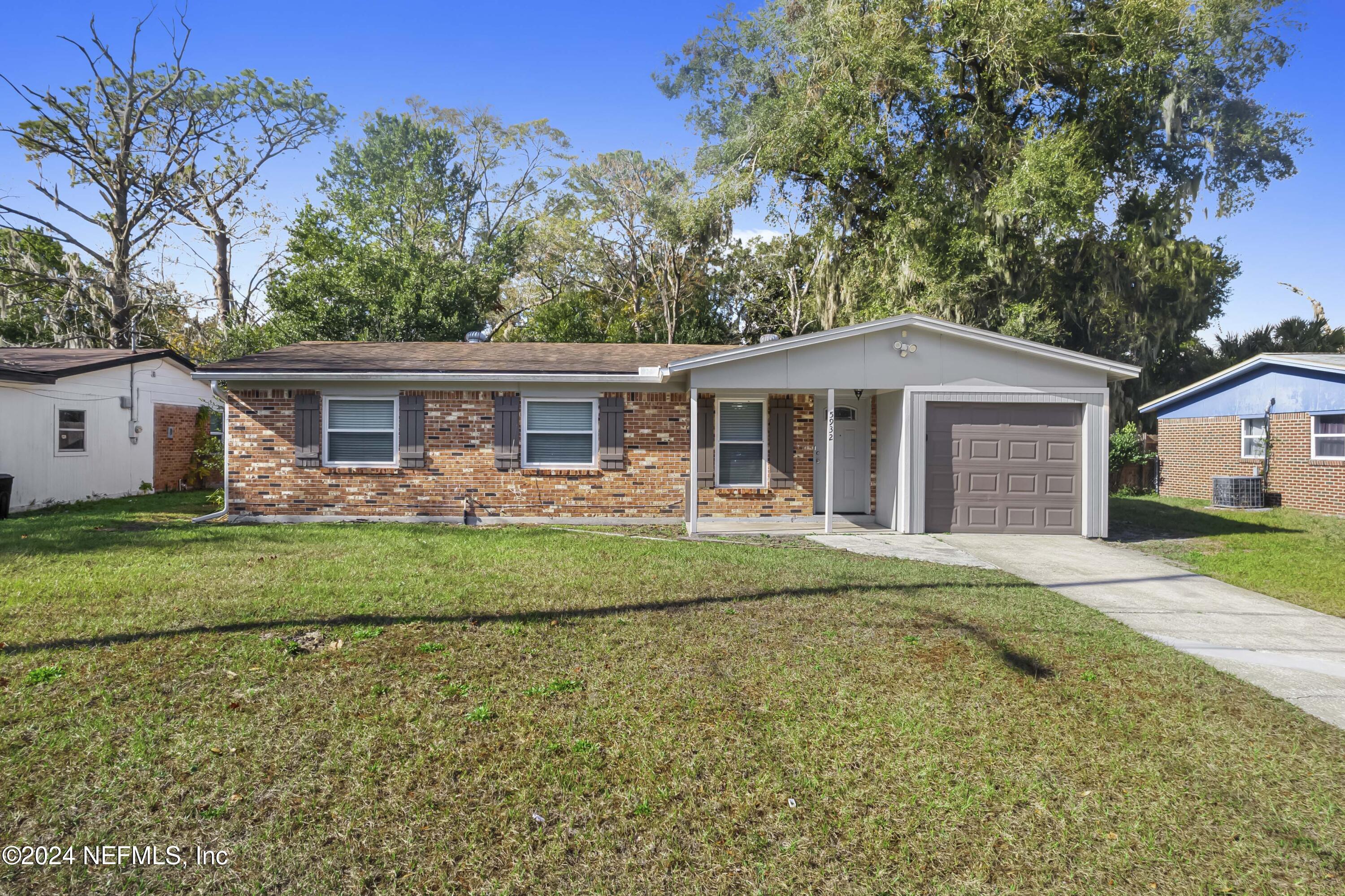 front view of a house with a yard